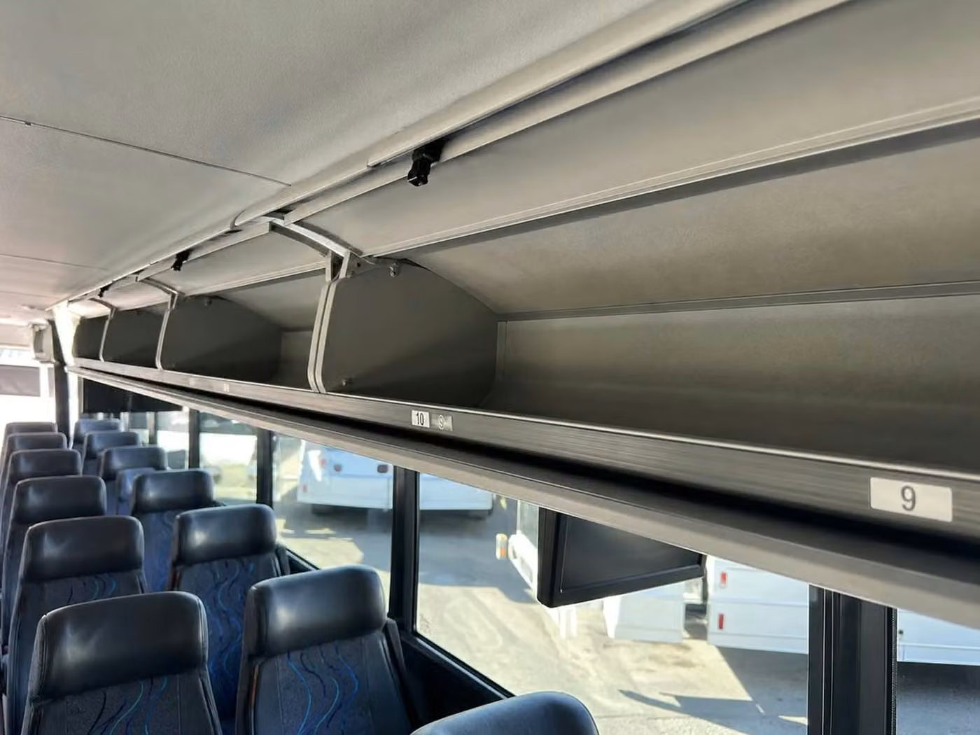 brighton 56 passenger charter bus overhead storage